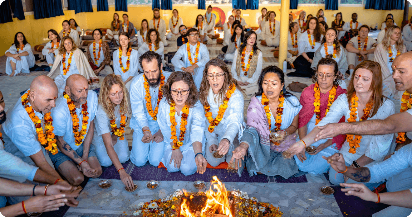 Yoga ceremony with practitioners around fire